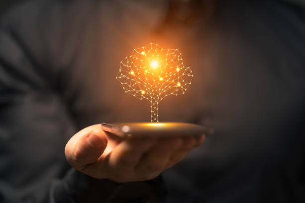 istock Artificial intelligence tree symbol on smartphone in the hand of a man 2158100297