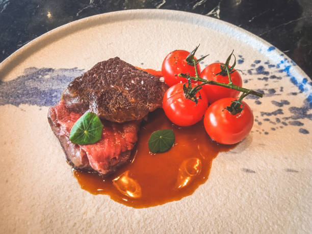 Wagyu Tri-tip made from 2GR Wagyu Tri-tip, red wine jus, baby tomatoes on vine