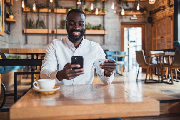 istock Modern businessman shopping online using mobile phone 2158102985