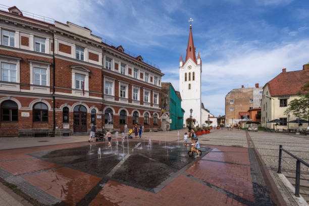 Cesis, Latvia - July 16,2023: The square and St.John`s hurch in the Latvian town Cesis