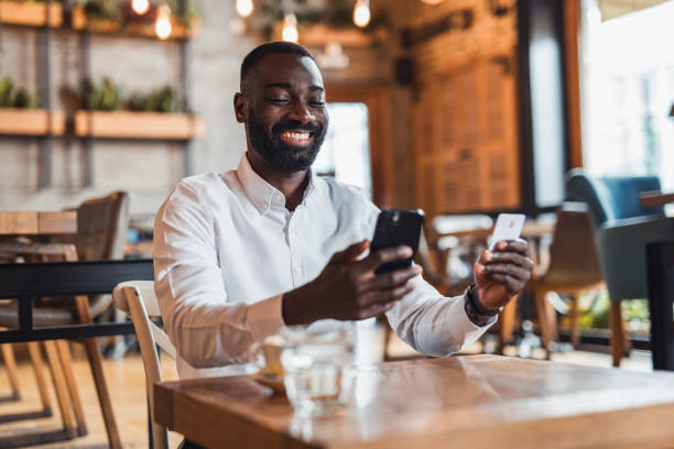 istock Modern businessman shopping online using mobile phone 2158103064