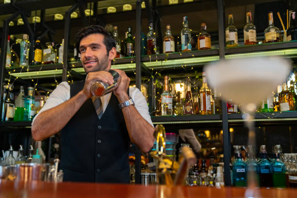 istock Male bartender preparing alcoholic drink at restaurant bar. 2158103636