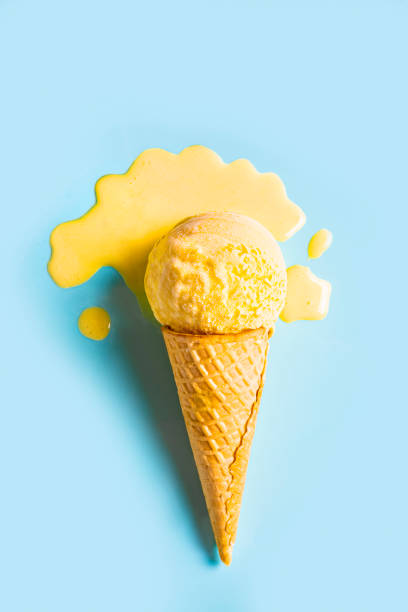 istock Yellow mango ice cream melting and spilling 2158108294