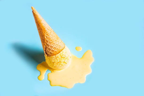 istock Yellow mango ice cream melting and spilling 2158108324
