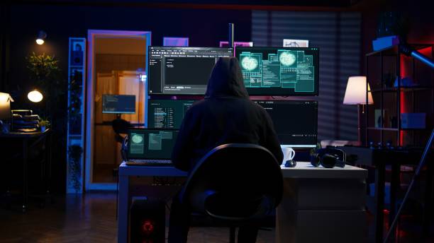 istock Hacker arriving in secret base with laptop, ready to start programming viruses 2158110752