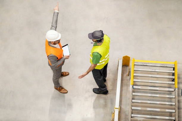 istock An angry manager is firing warehouse worker. 2158110778