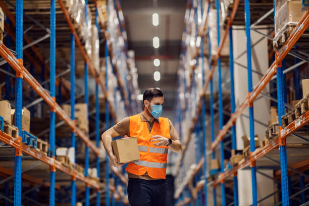 istock A delivery center worker is organizing shipment and boxes in facility. 2158111680
