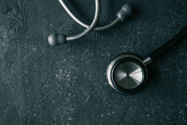 istock Stethoscope on black background, top view. Space for text 2158112760