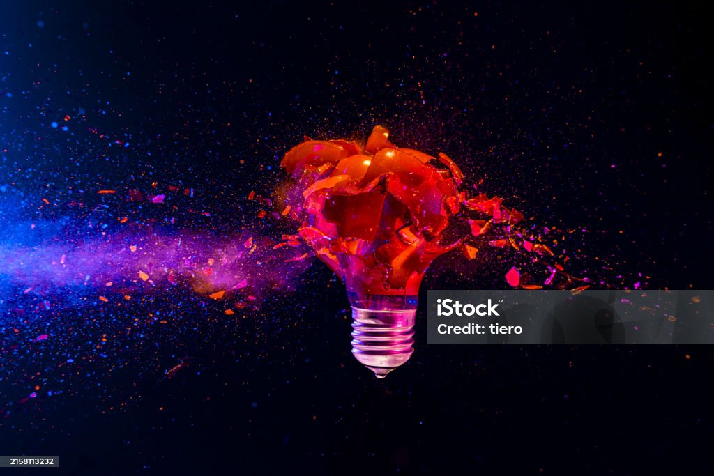 Red Light Bulb Exploding With Colorful Powder On Dark Background Stock ...
