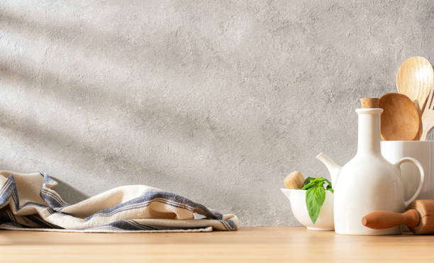 Culinaty backgrounds. Kitchen table with utensils and copy space. Abstract gray background