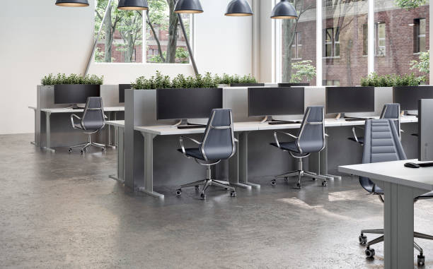 istock Modern office interior with work desks and large windows  on cement floor in the morning sun 2158116713