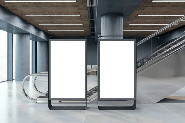 istock Two blank advertising displays in a modern interior, realistic style, against a glass facade, concept of promo space. 3D Rendering 2158116790