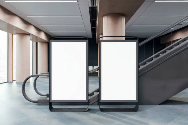 istock Two blank advertising lightboxes in a modern building interior, designed for branding and promo on a clean background, concept of advertising. 3D Rendering 2158116823