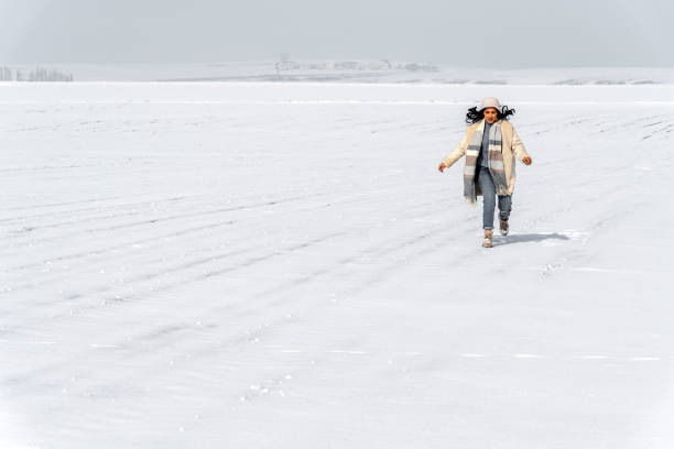 istock Young Woman having fun in the Snow at Winter 2158117182