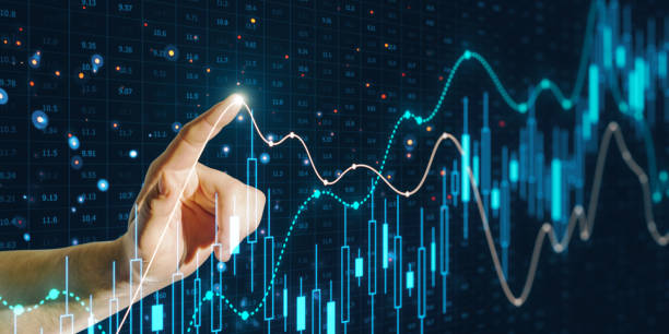 istock A hand interacting with glowing financial graphs, representing a concept of data analysis on a dark background with digital overlays 2158117208