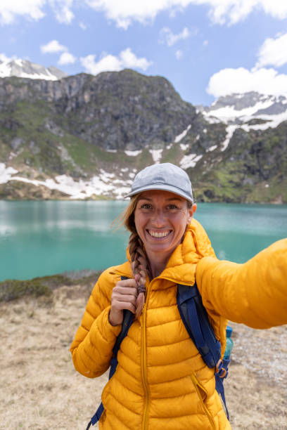 istock Female portrait: Smiling Hiker's Alpine Snapshot 2158117249