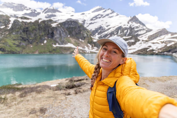 istock Happy Hiker's taking a selfie by an alpine lake 2158117351