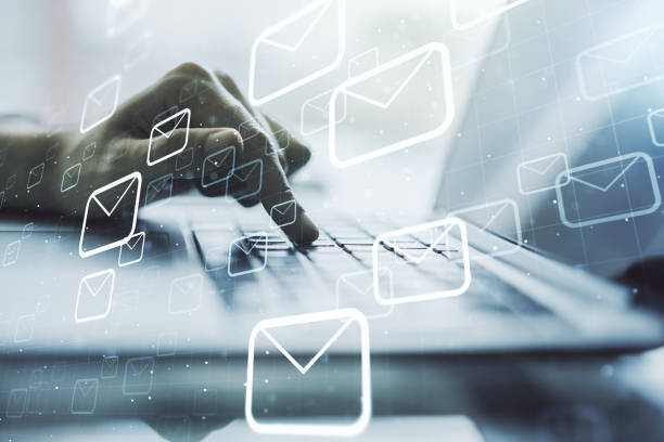 istock Creative concept of postal envelopes illustration with hands typing on laptop on background. Email and communications concept. Multiexposure 2158117531