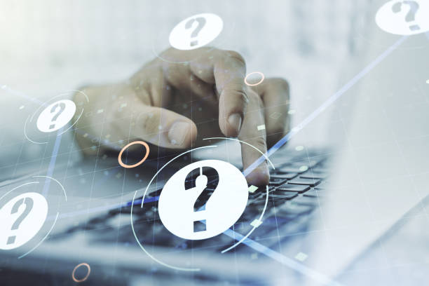 istock Creative concept of question mark illustration and hands typing on laptop on background. FAQ and search concept. Multiexposure 2158117535