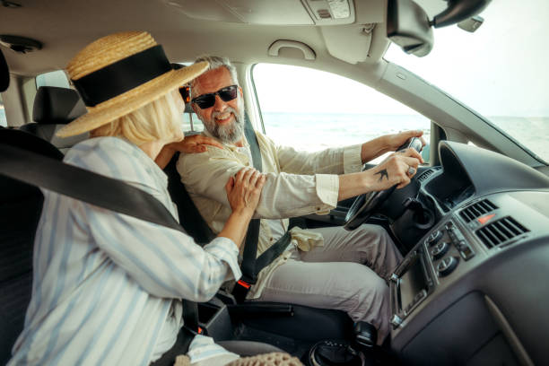 istock Mature couple bonding while enjoying car ride together 2158120458