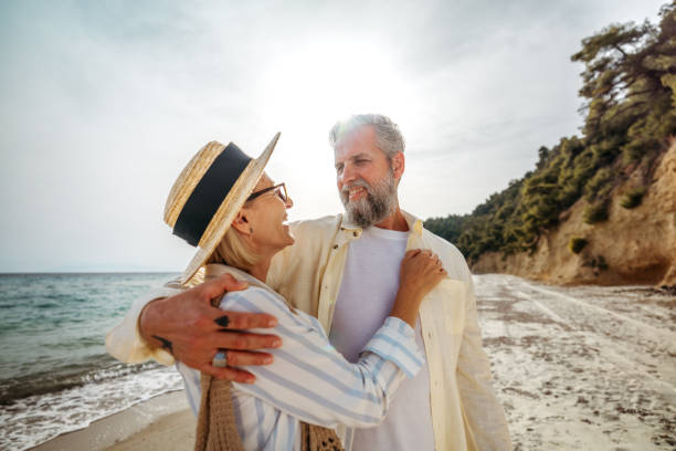 istock Mature couple bonding on a beach 2158120505