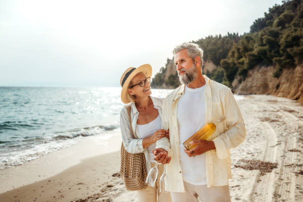 istock Mature couple enjoying day on a beach 2158120538