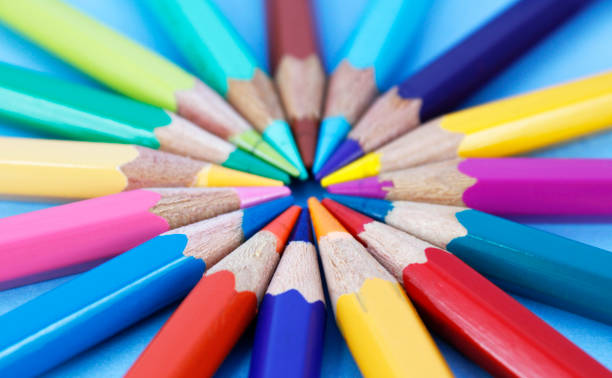 istock Group of colored pencils pointing towards a center 2158121537