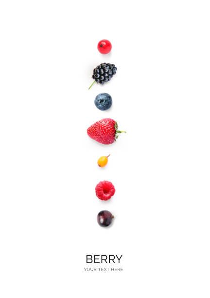 Mix berries and fruits at border of image with copy space for text. Ripe cherries, strawberries, currants and mulberrieson isolated on a white background. Background berries. Various fresh summer berries. Top view.
