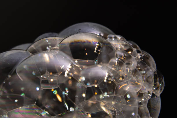 istock Close up real soap bubbles with black background in abstract, unique background style, design. 2158122290