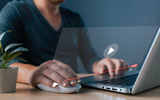 istock Businessman is using and touching tablet screen in broadcasting, digital technology, social media, and virtual video advertising and marketing concept. live streaming digital marketing 2158124152