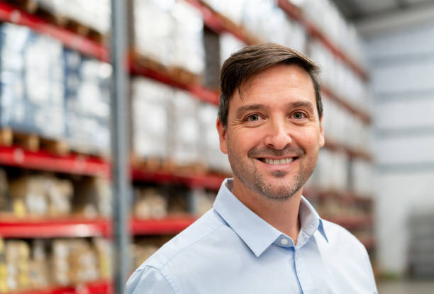 istock Happy businessman working at a distribution warehouse 2158124404