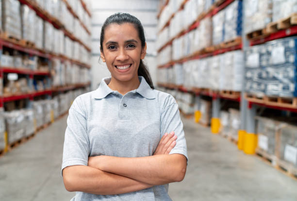 istock Happy woman working at a distribution warehouse 2158124407