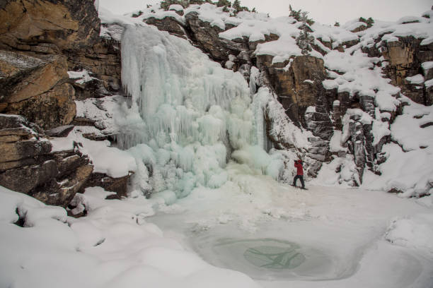 istock Incredible winter scenery in Yukon Territory, Canada with a frozen waterfall. Background, back drop photo. 2158125082