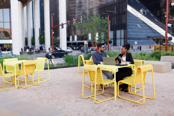 istock Productive people working during their lunch break in the downtown district 2158125306
