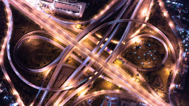 istock Expressway top view, Road traffic an important infrastructure, Drone aerial view fly in circle, traffic transportation, Public transport or commuter city life concept of economic and energ, transport. 2158126037