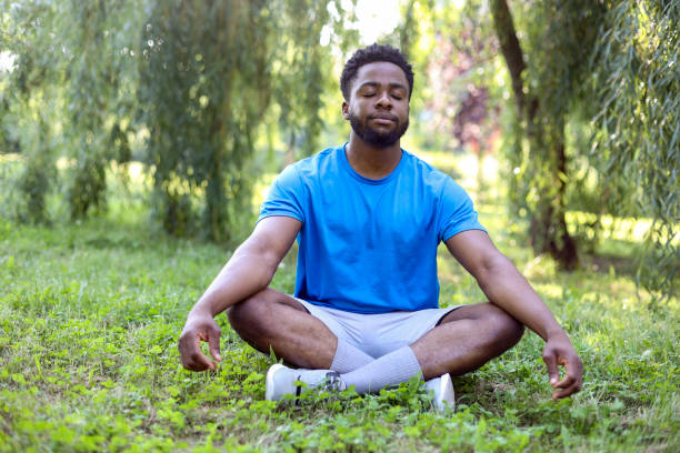Young man meditating in nature