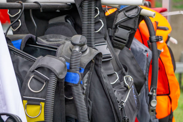istock vests, diving equipment hung on hangers 2158127514