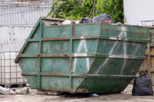 istock A large green dumpster is full of trash 2158128473