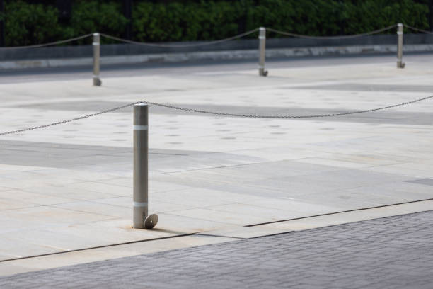 istock A row of metal poles with a chain hanging from them 2158128548