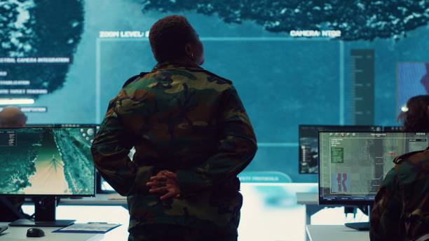 istock Woman army officer coordinating special operations mission in command post 2158129792