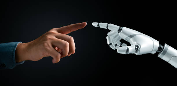 istock Human and robot hands reaching out to touch. Symbolizes human-AI interaction, futuristic cooperation. Technology and innovation concept. Cybernetic partnership. 2158132113