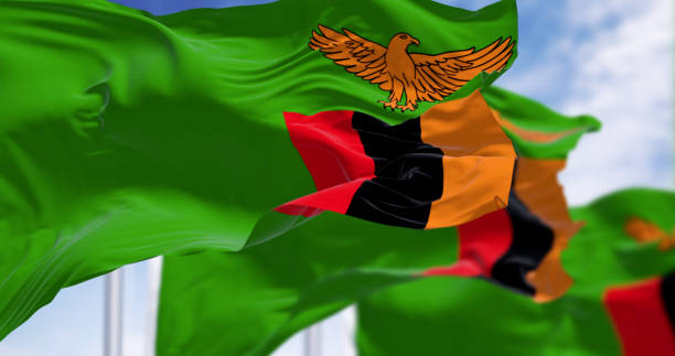 istock Zambia national flags waving on a clear day 2158133044