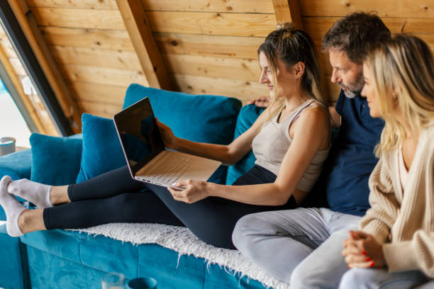 istock Three friends having relaxing time in a countryside house 2158133080