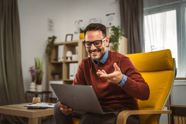 istock Man work from home and have video call on laptop share graphs 2158133536