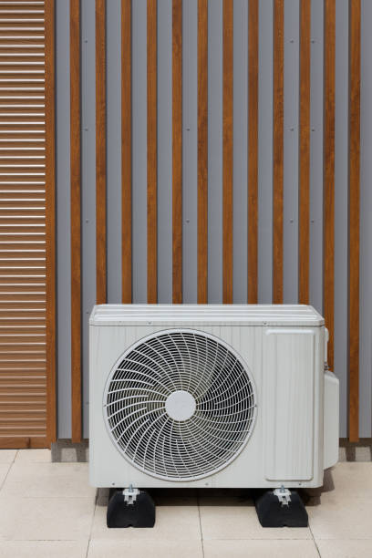 istock Air Conditioner Heat Pump Outside Building 2158136346
