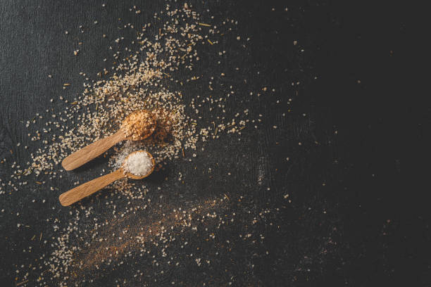 istock Wooden spoons with different spices on a black background, banner 2158141642