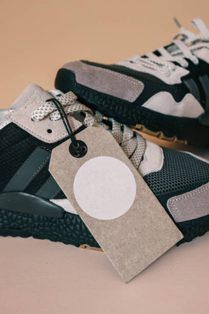 istock Pair of men's sneakers with blank tag 2158142784