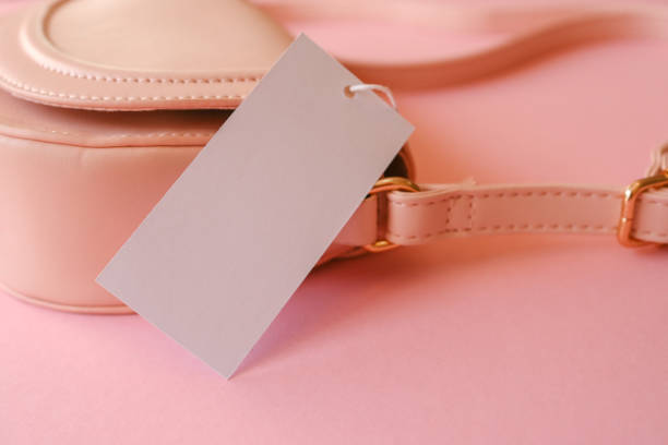 Women's pink bag with thick tag, copy space.