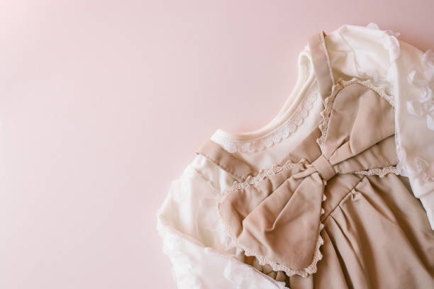 istock Top view flat lay beige children dress on beige background 2158143165