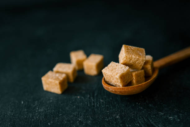 brown sugar heap and wooden spoon.